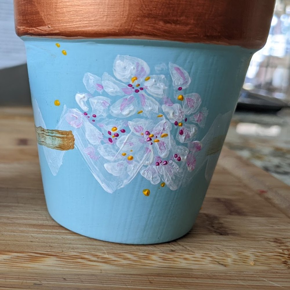handpainted garden pots.   All different colors available.